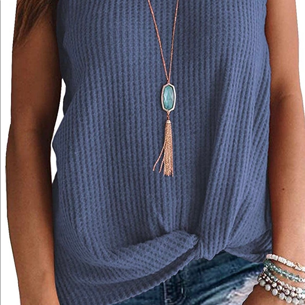 Light knitted sleeveless top with a knot twos in front middle